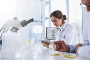 Its a high-tech workspace. Shot of two scientists working in a lab.